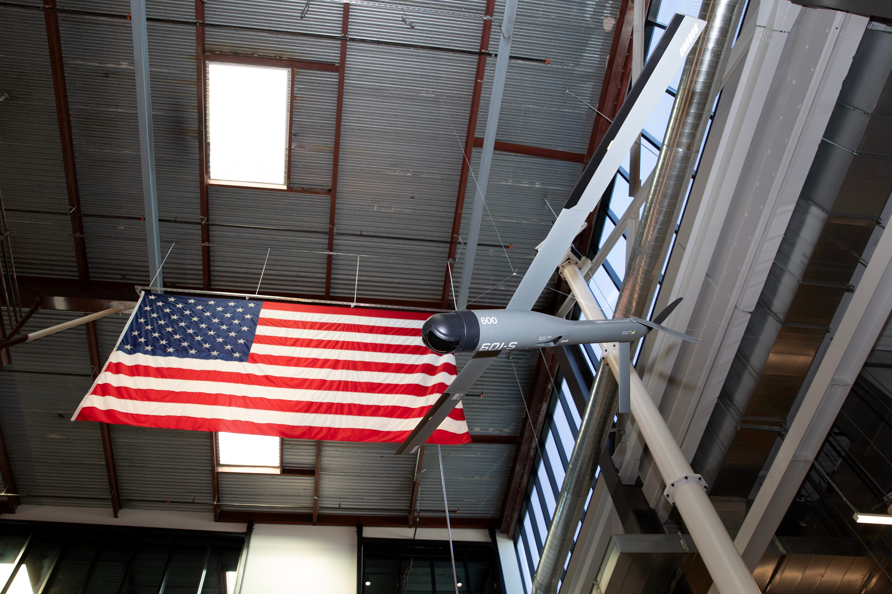 The Altius-600 is seen at the Anduril headquarters next to an American flag