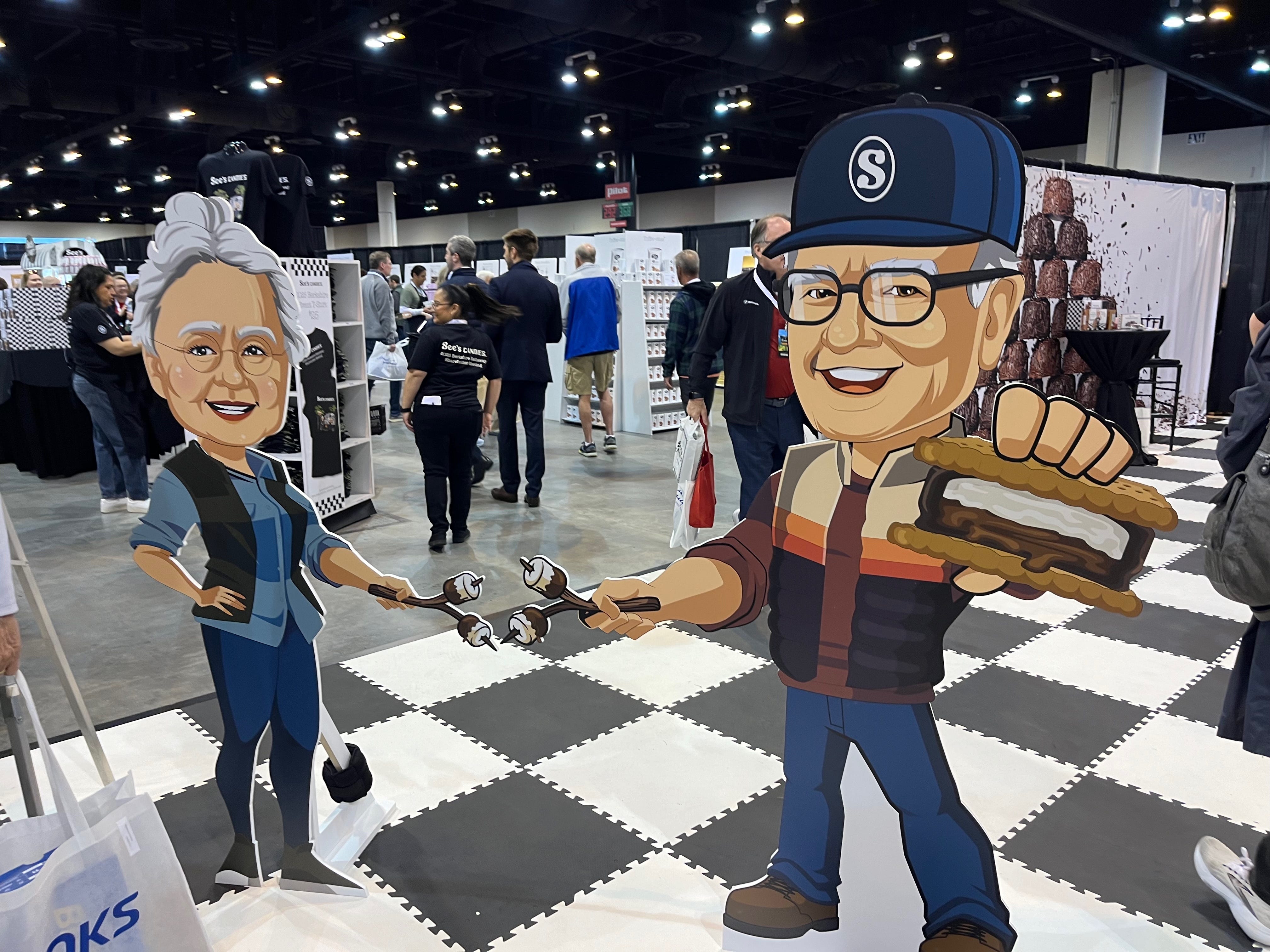 Life-sized cardboard cutouts of Mary See and Warren Buffett/