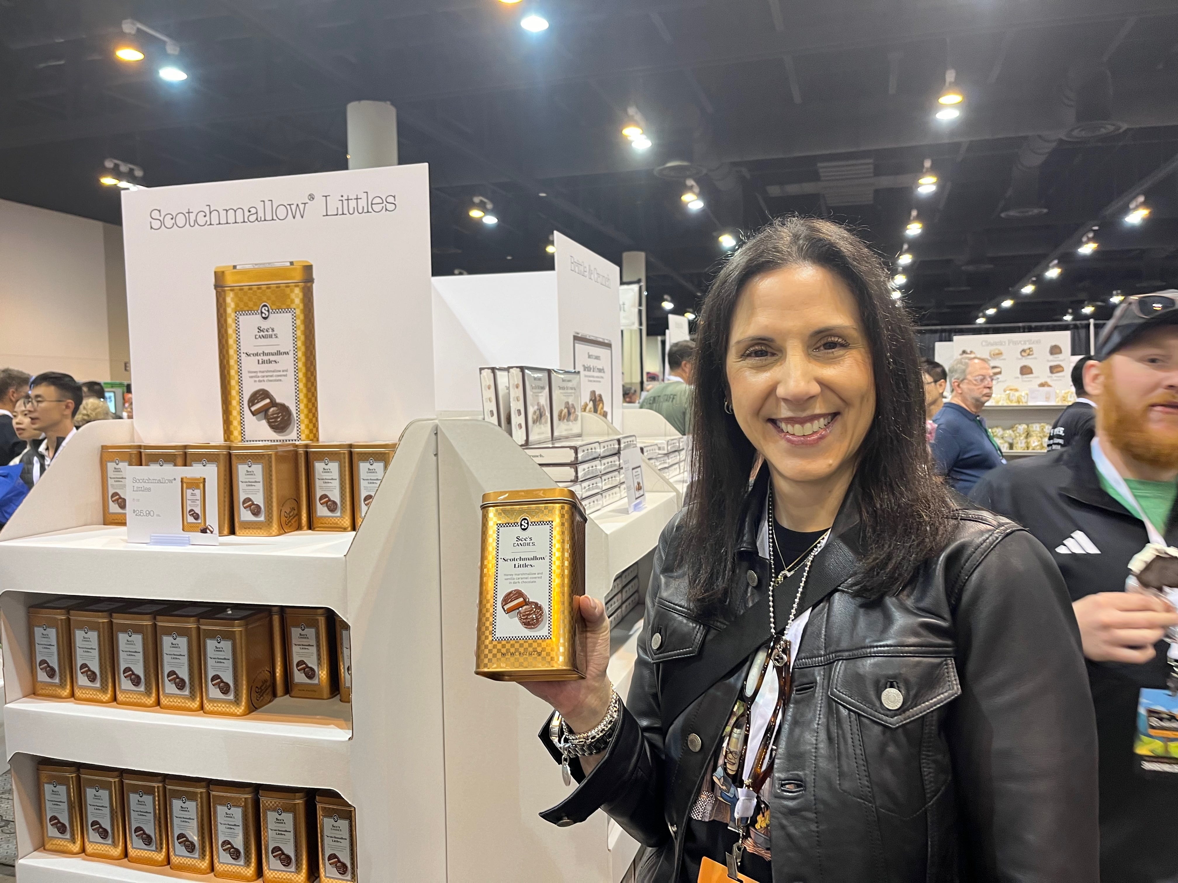 A See's rep showing off a product.