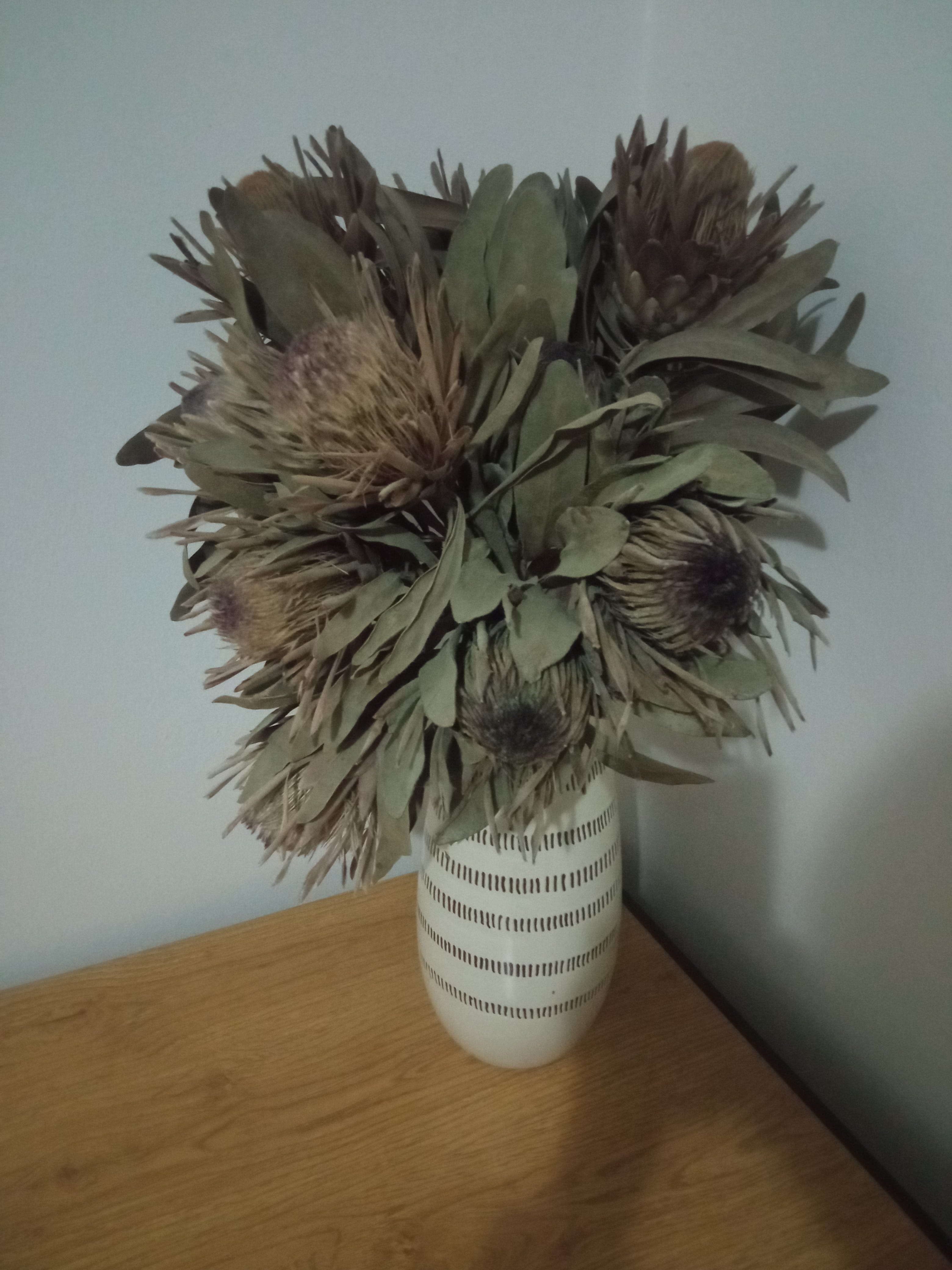 Dusty old flowers in a vase