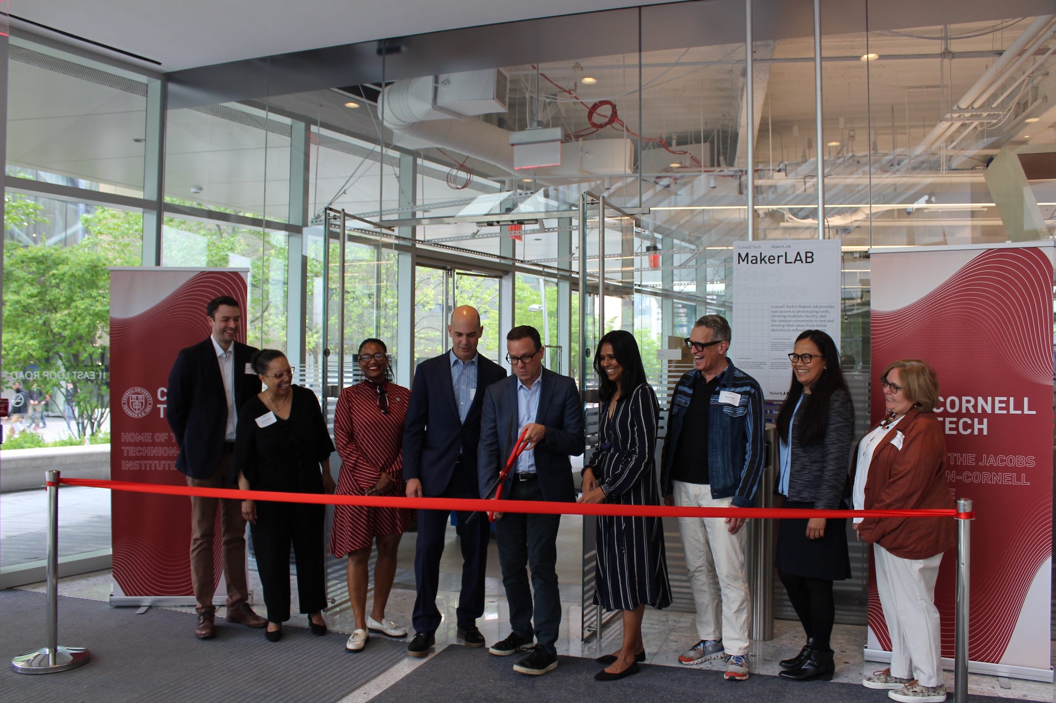 Greg Morrisett (Center) cuts a red ribbon christening the opening of Cornell Tech's MakerLab