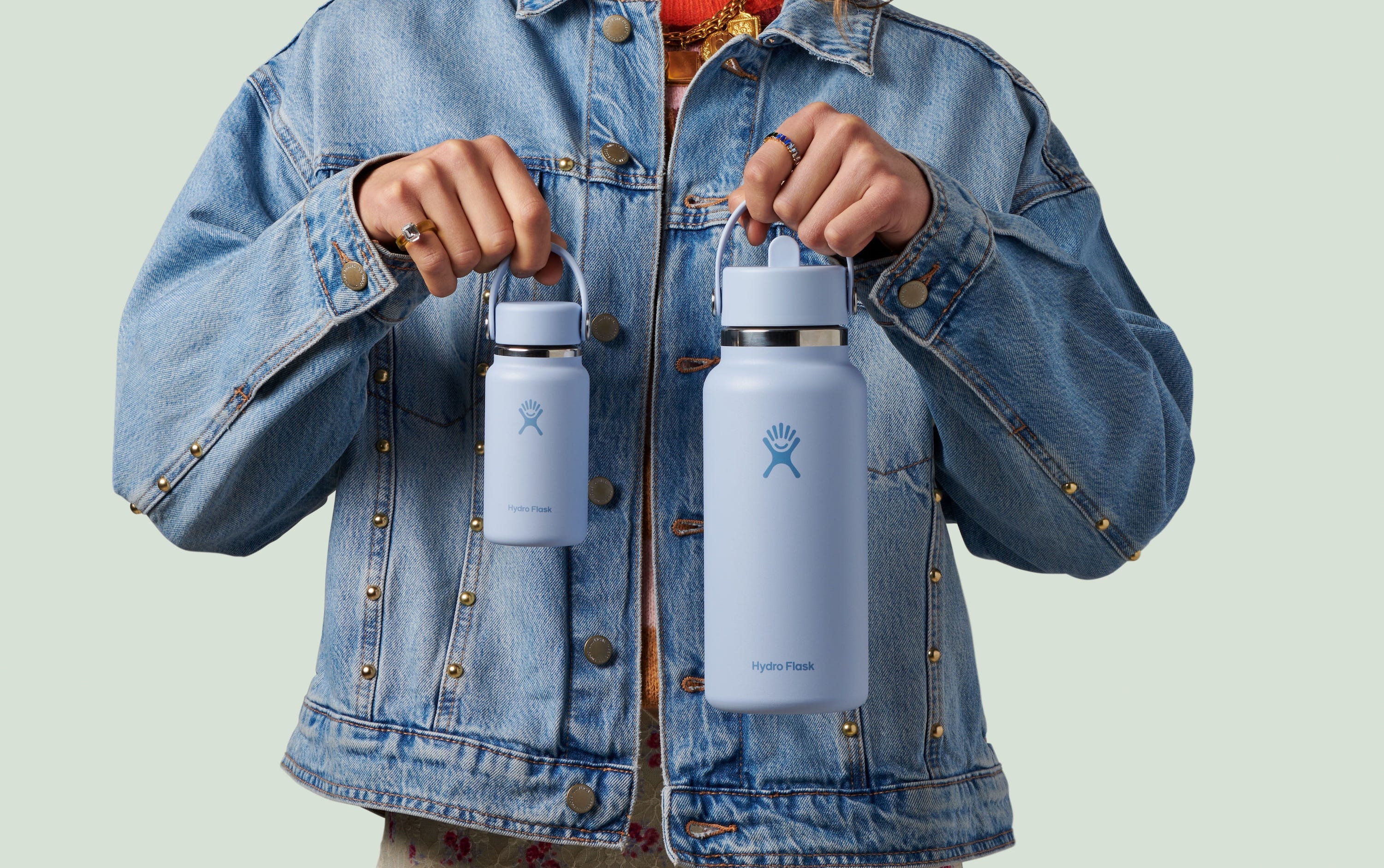 A blue micro Hydro Flask bottle (left) compared to an average-sized Hydro Flask (right) in the same color..
