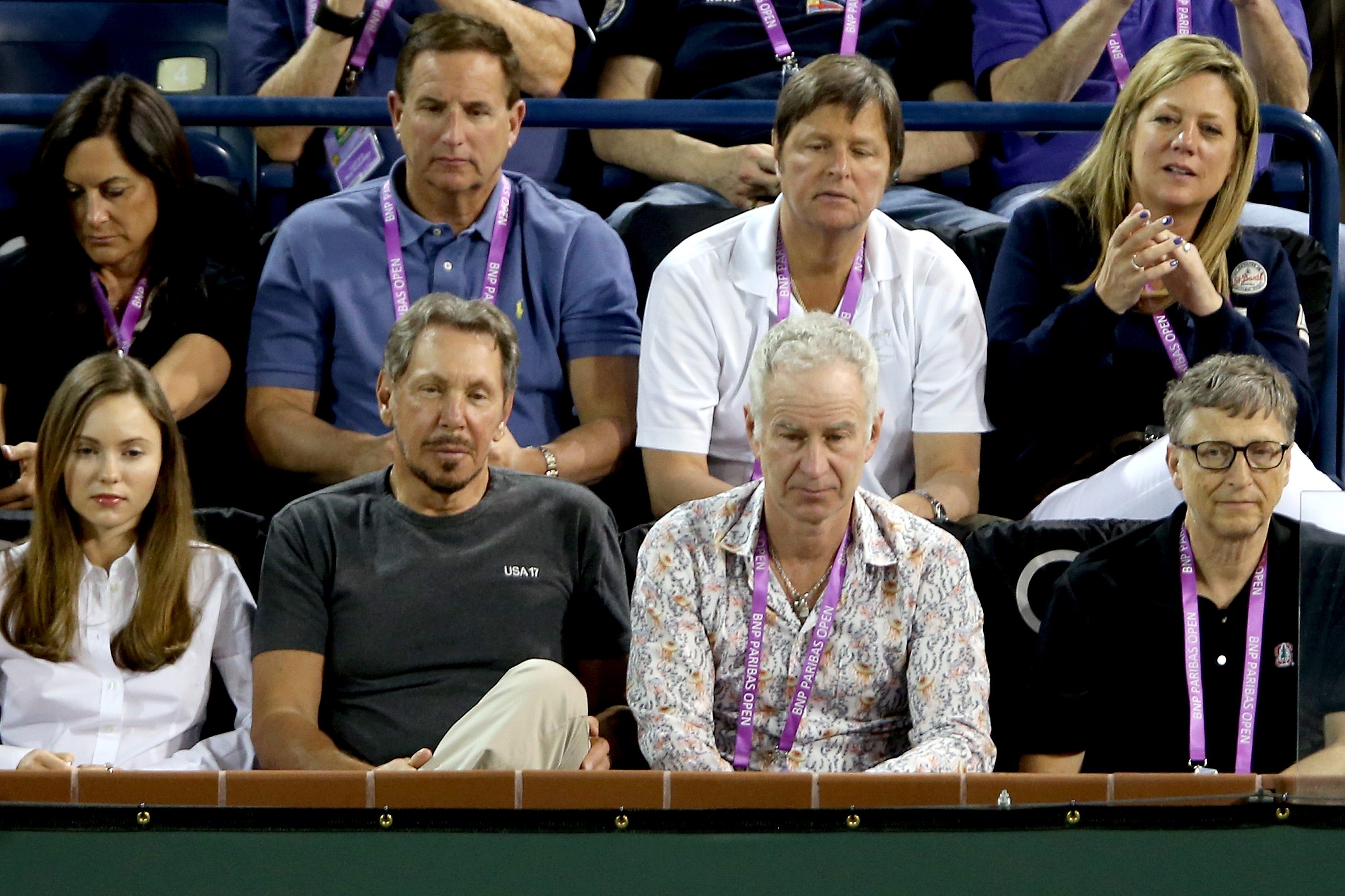 Paula Hurd (top row, first on the left) and Mark Hurd (top row, second from the left) were seated behind Bill Gates (bottom row, first on the right) at a 2015 tennis tournament.