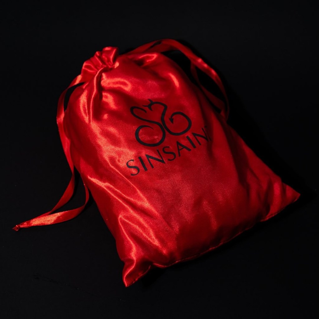 red bag with sin saint logo