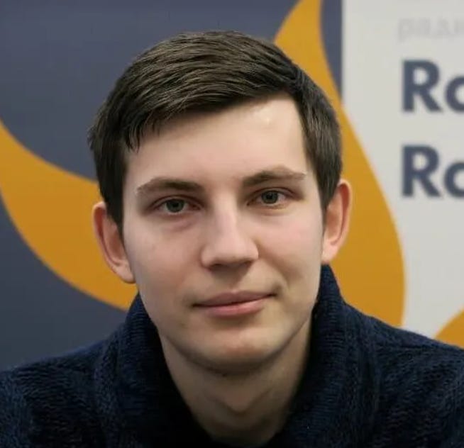 Ihar losik in blue sweater