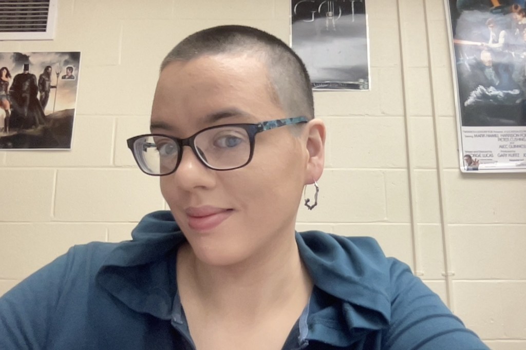 Waterville Senior High School English teacher JoAnna St. Germain, wearing eyeglasses, poses for a selfie