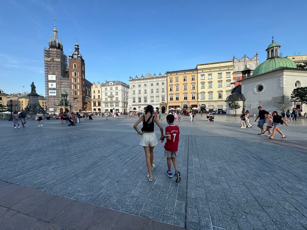 Two kids walking in Krakow Poland