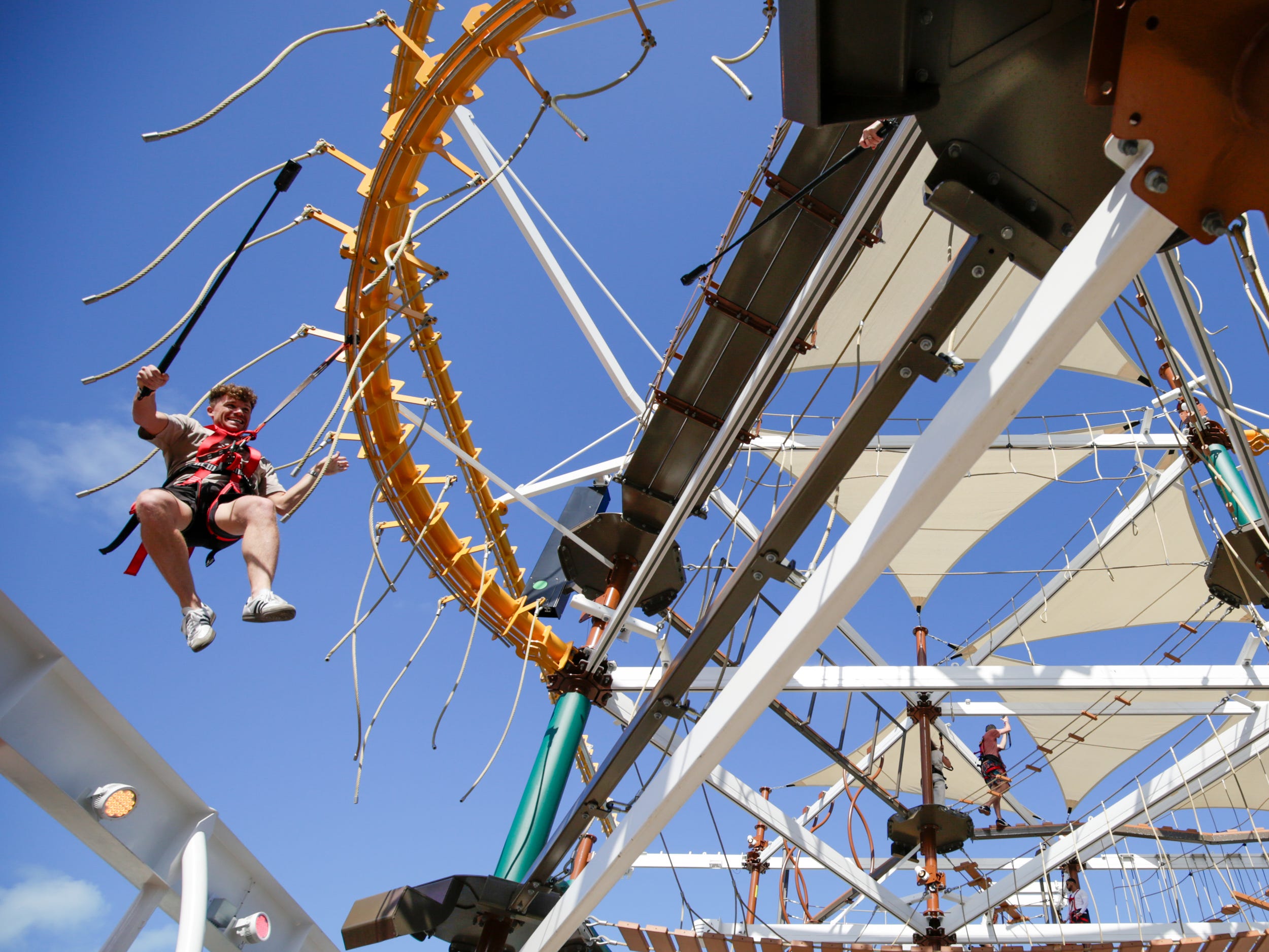 person on ropes course at the Harbour on MSC World America