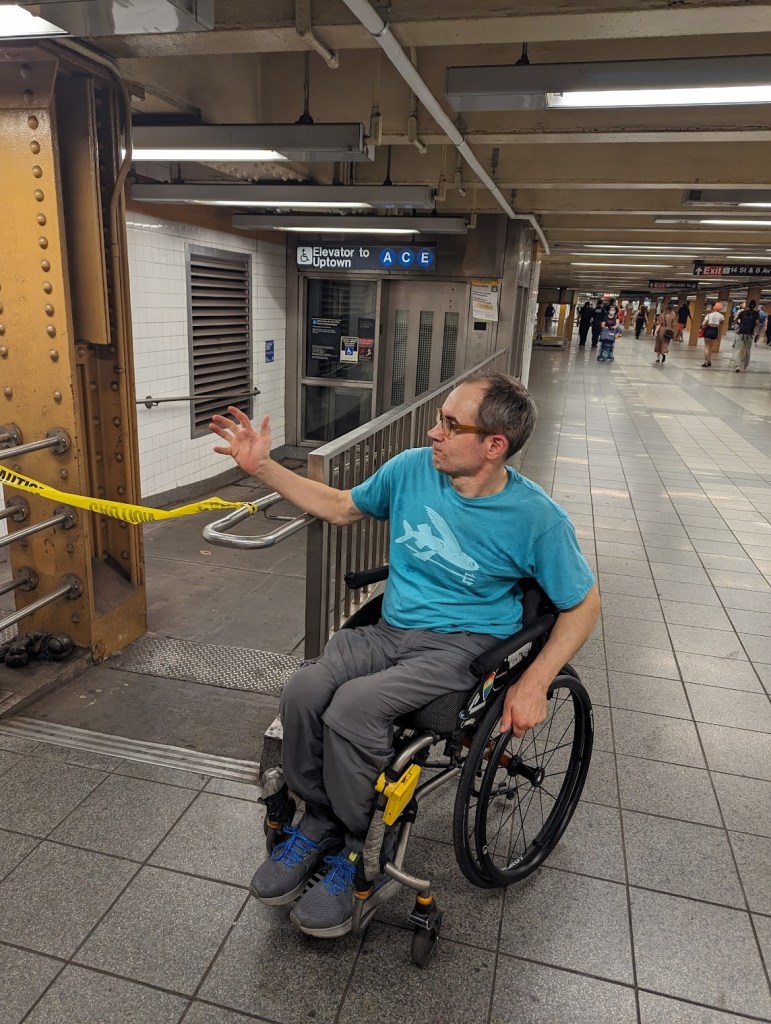 Sasha Blair-Goldensohn in front of a different out of service elevator