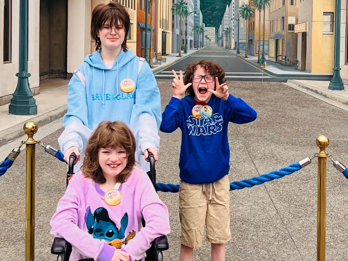 Kids posing for photo at Disney