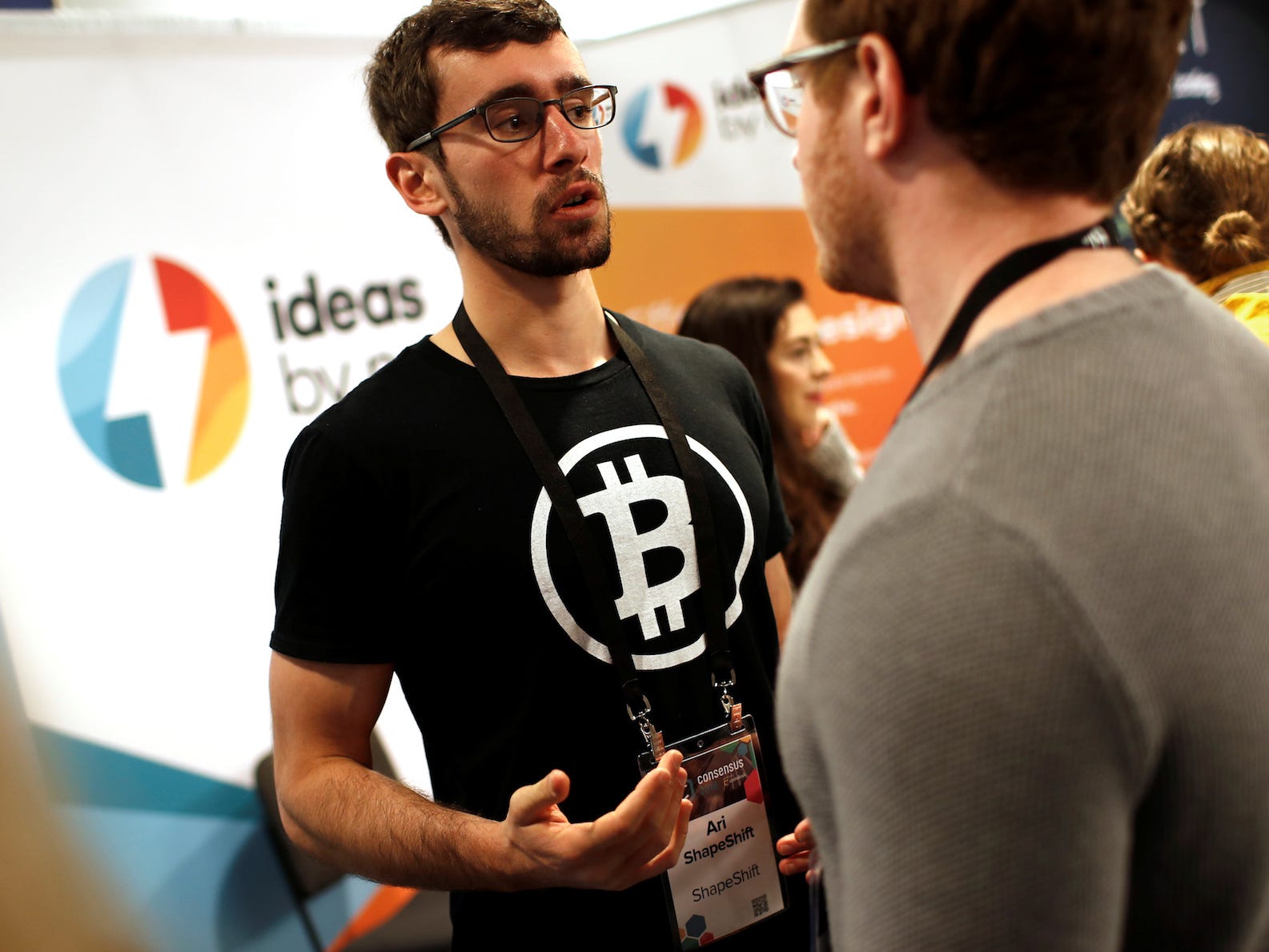 A man wears a Bitcoin logo t-shirt on the floor of the Consensus 2018 blockchain technology conference in New York City, New York, U.S., May 16, 2018.