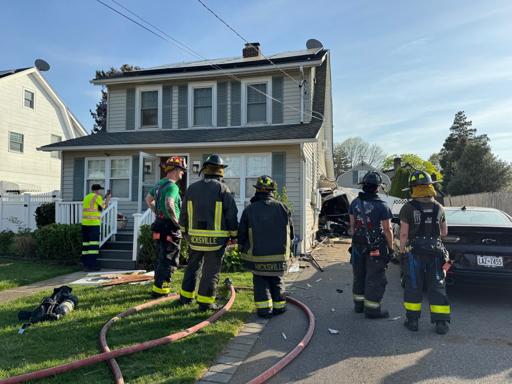 Vehicle into a house in Hicksville.