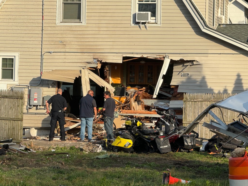 Vehicle into a house in Hicksville.
