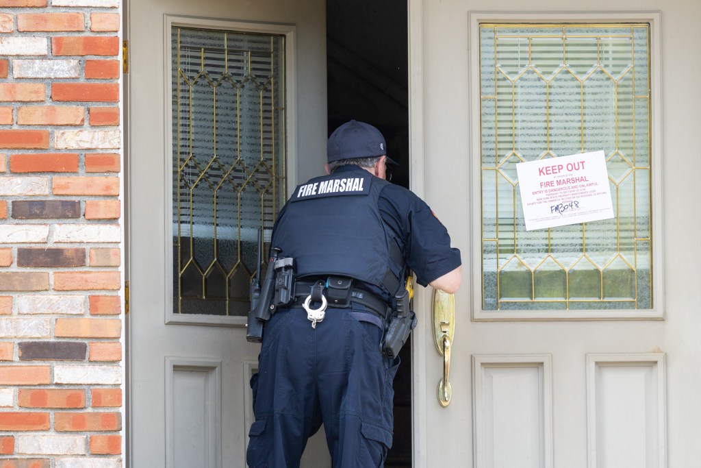 Officials said the feline corpses were inside a freezer and strewn around the Bohemia home.
