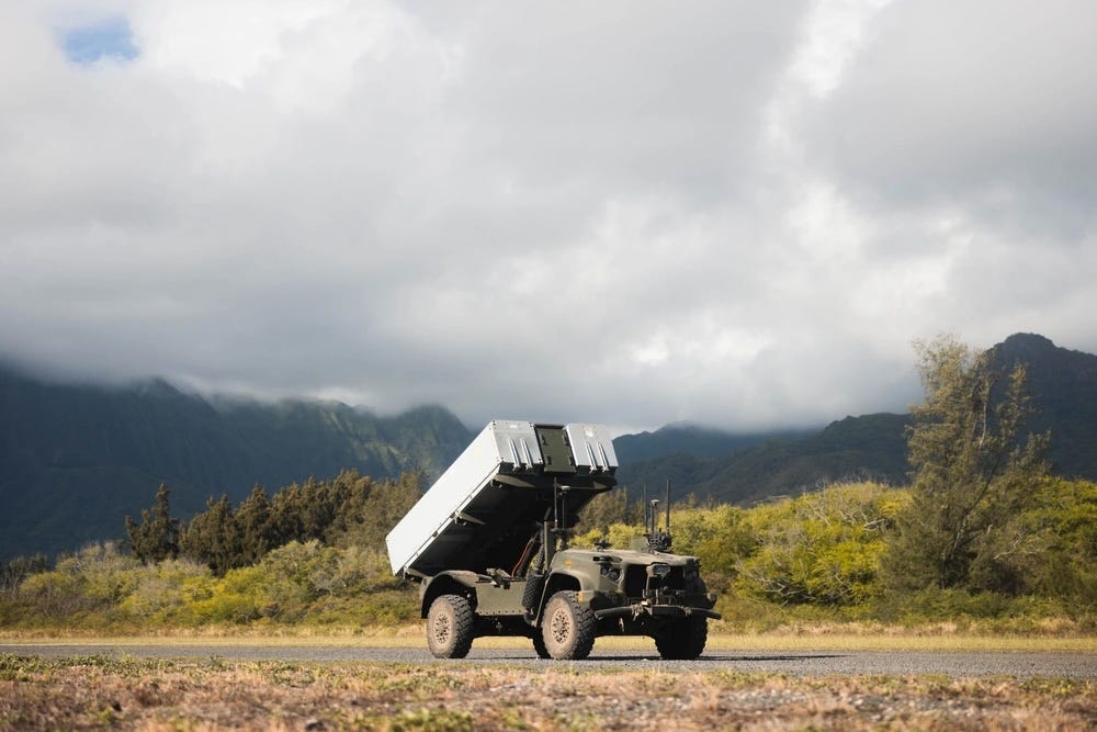 The NMESIS drives on a gravel road on Marine Corps Training Area Bellows in Hawaii.