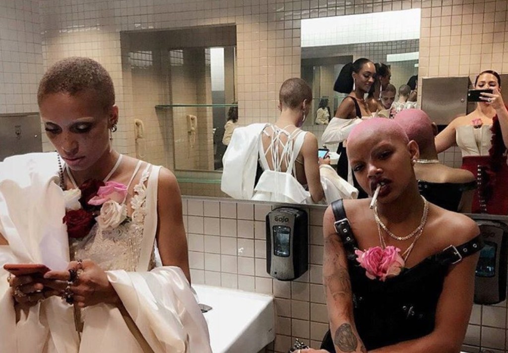 Slick Woods smoking in the bathroom at the Met Gala with model Adwoa Aboah. 