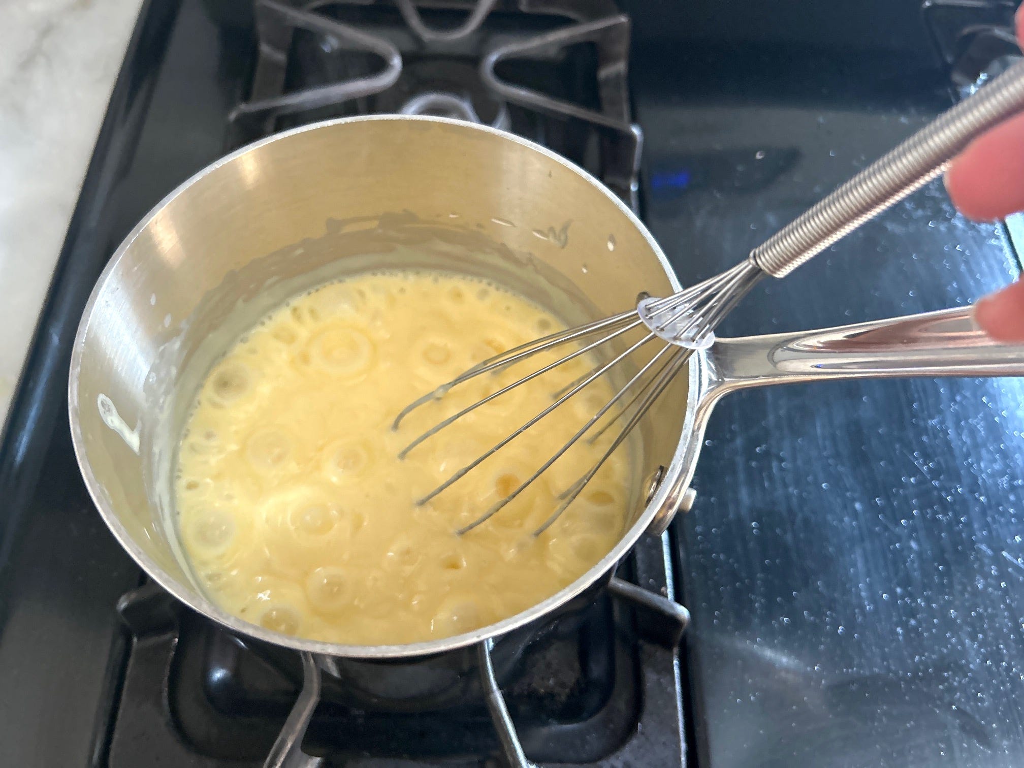 Pudding boiling on the stove for Meghan Markle's Chantilly Lily
