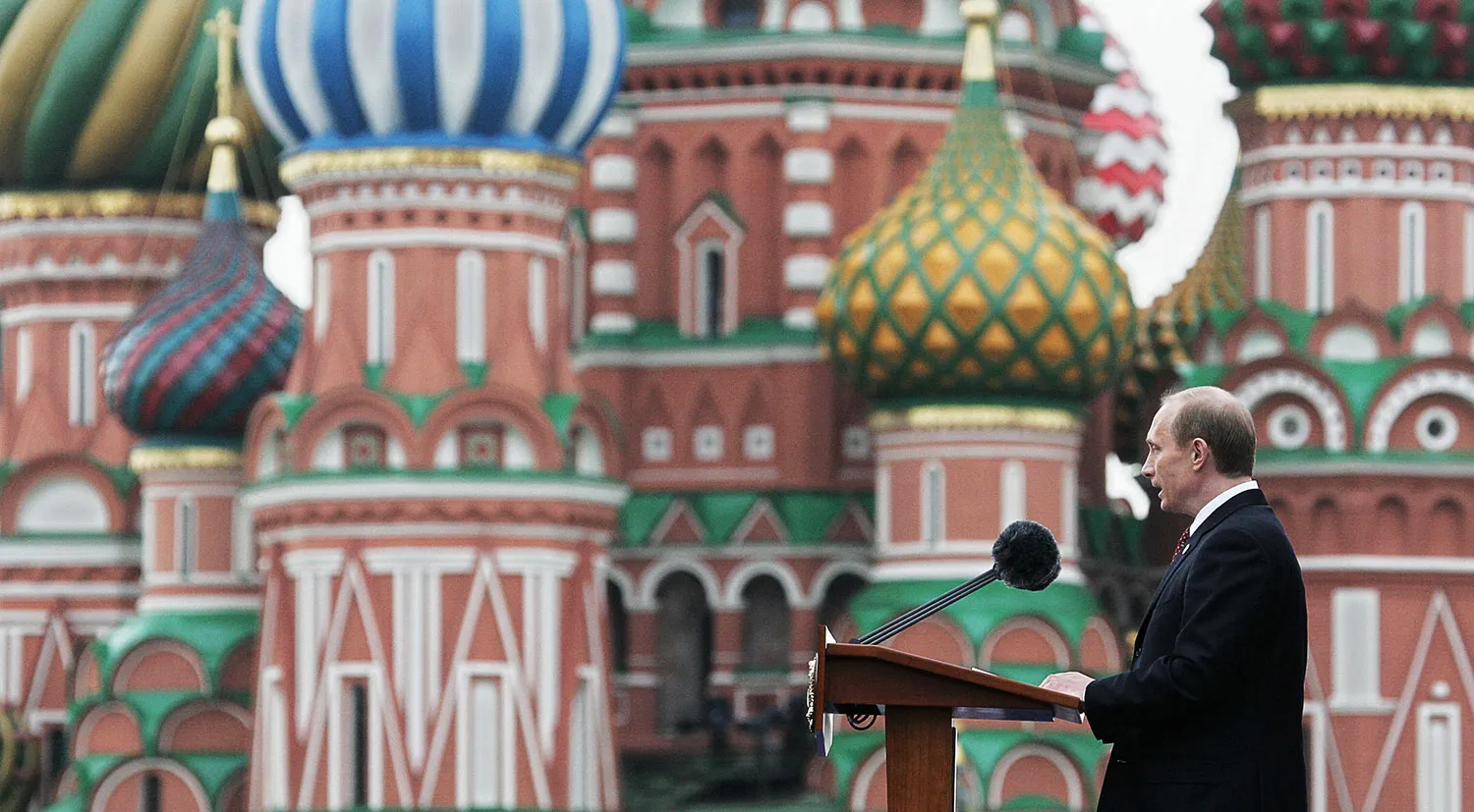 Russian President Vladimir Putin speaks prior the military parade