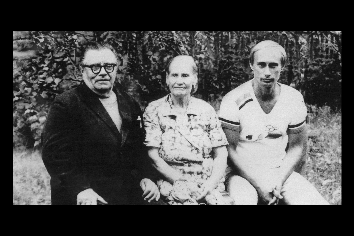 Putin (right) with his parents in 1985 just before his departure to East Germany as a KGB officer.