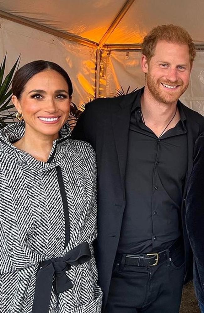 Prince Harry and Meghan Markle smiling