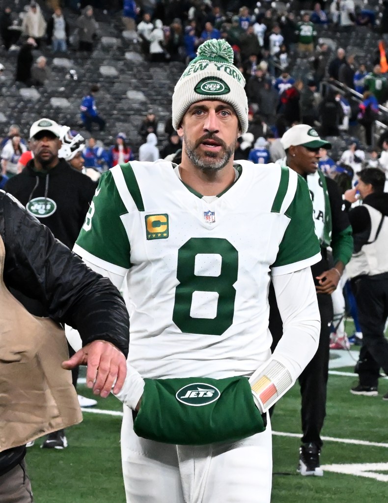 Aaron Rodgers (8) leaves the field after the Buffalo Bills defeated the Jets 23-20 in East Rutherford, NJ. 