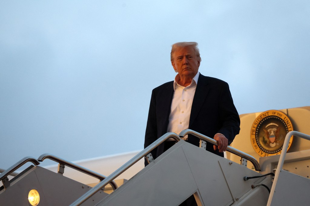 U.S. President Donald Trump exiting Air Force One at Joint Base Andrews, returning from a weekend trip to West Palm Beach, Florida