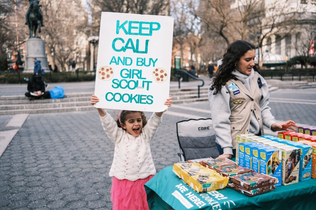 Eliana and Avianna sell girl scout cookies at Union Square.