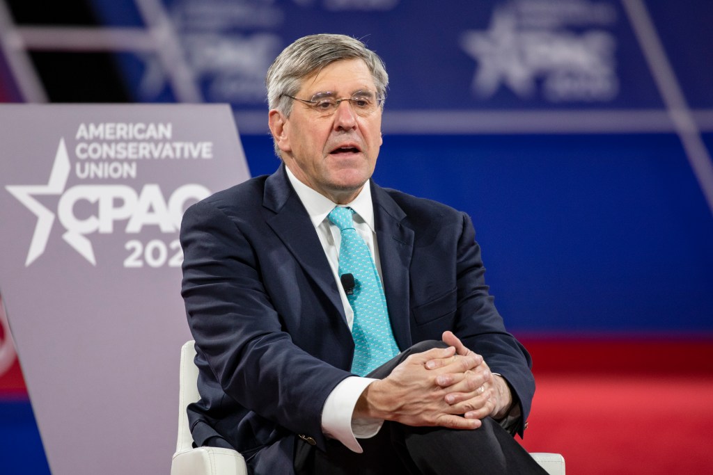 Stephen Moore conversing with Acting White House Chief of Staff Mick Mulvaney on stage at the Conservative Political Action Conference 2020