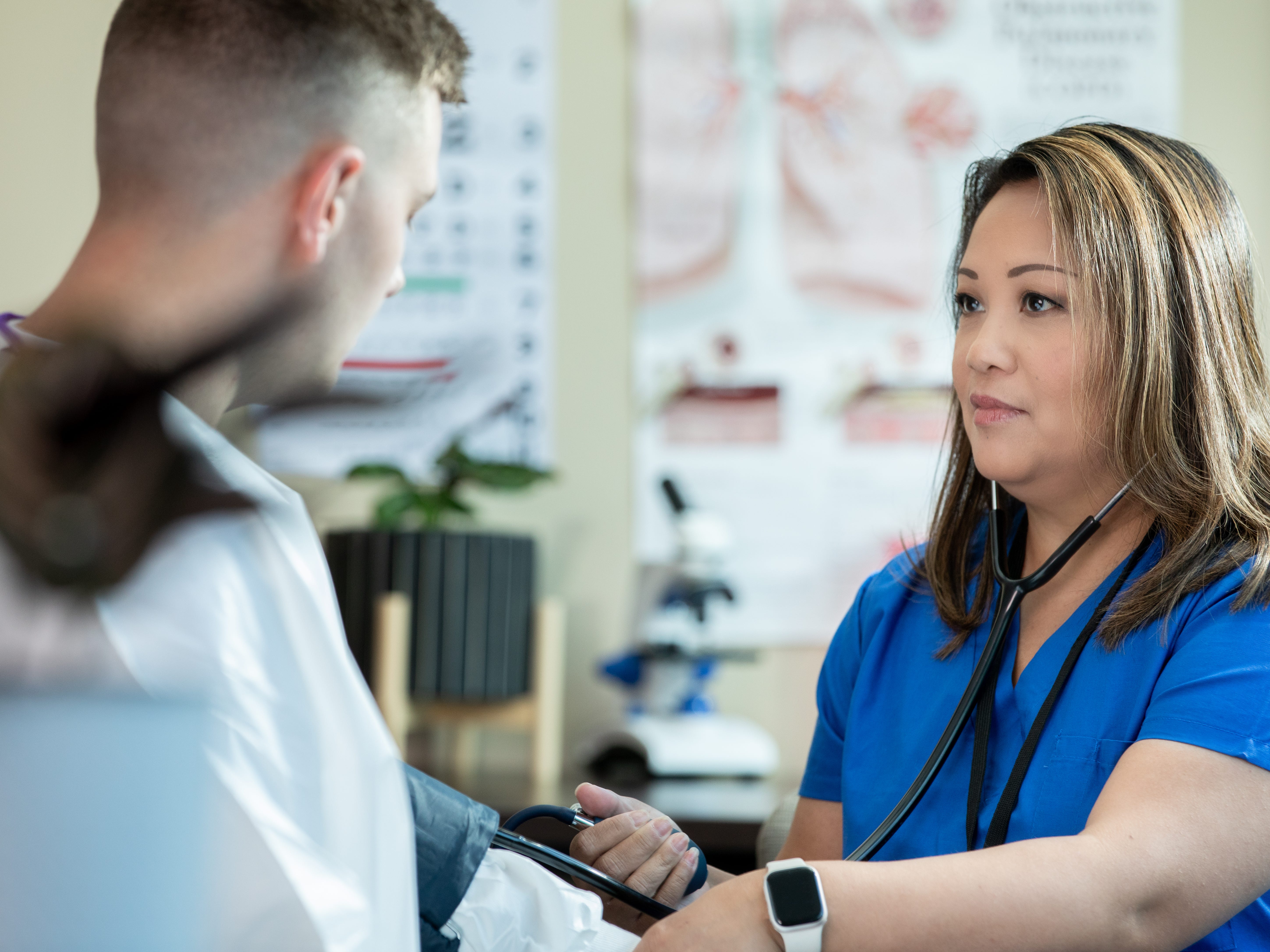 A healthcare worker with a patient