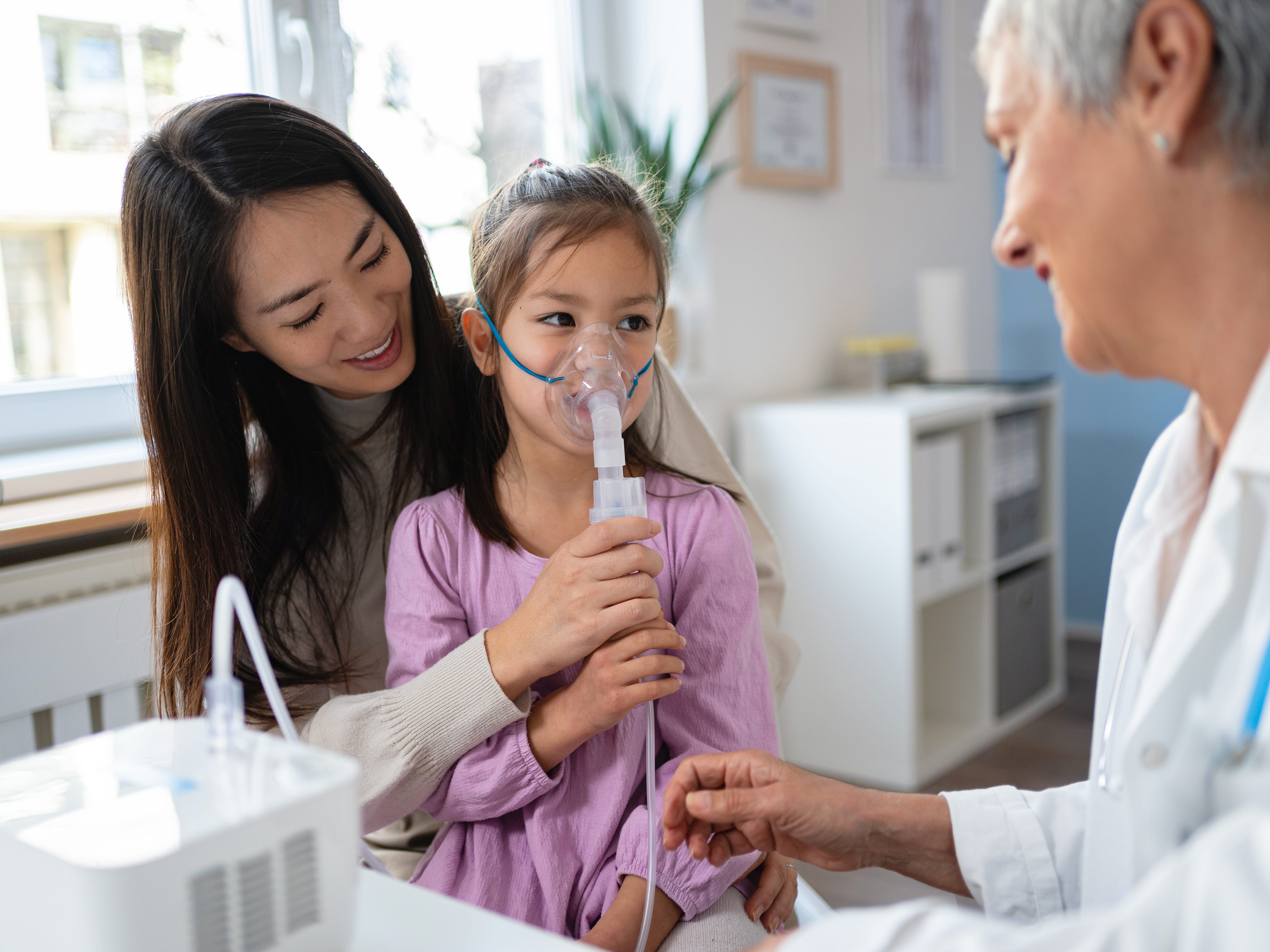 A child using a nebulizer