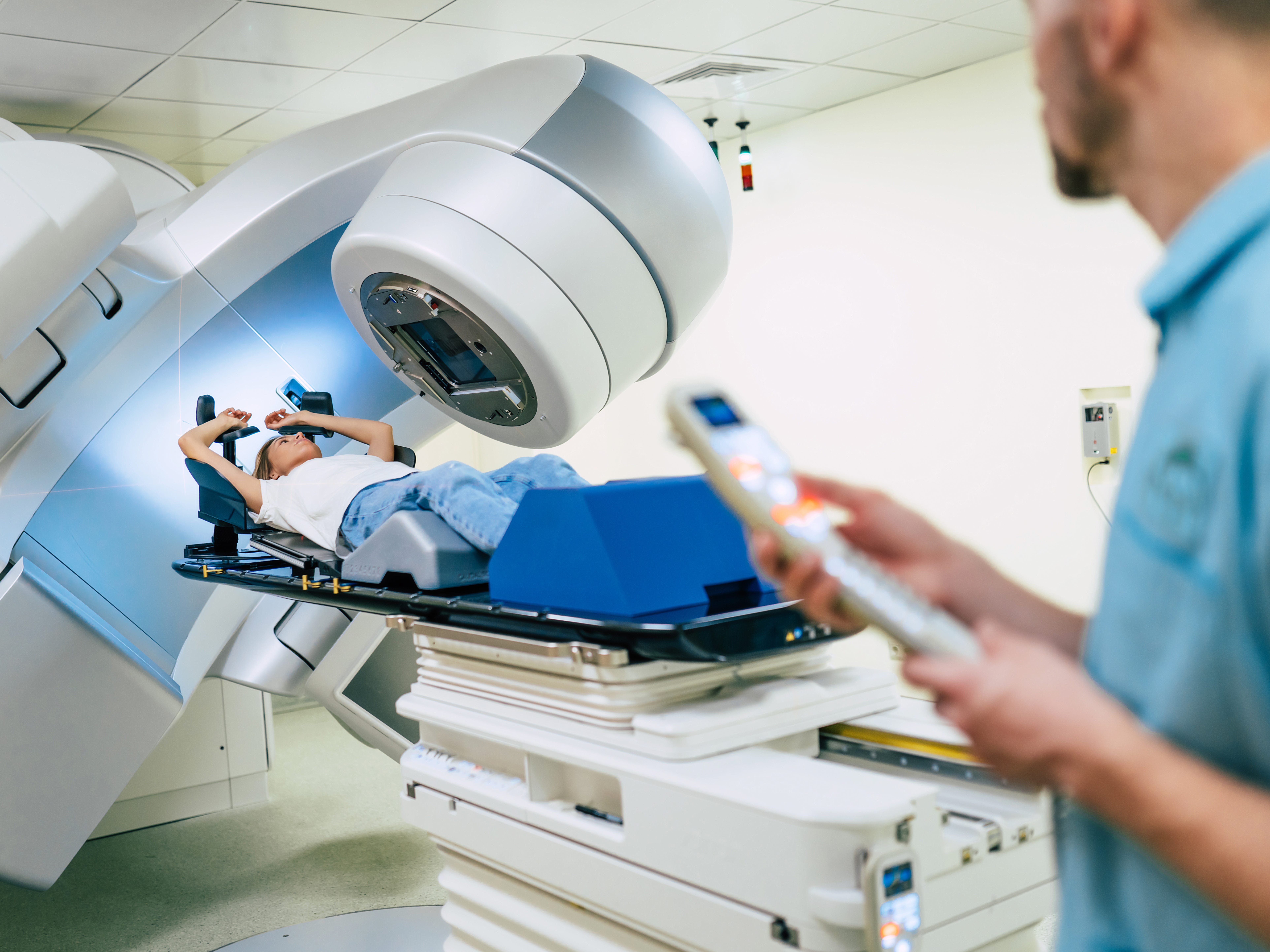 Healthcare worker, patient, and a linear accelerator
