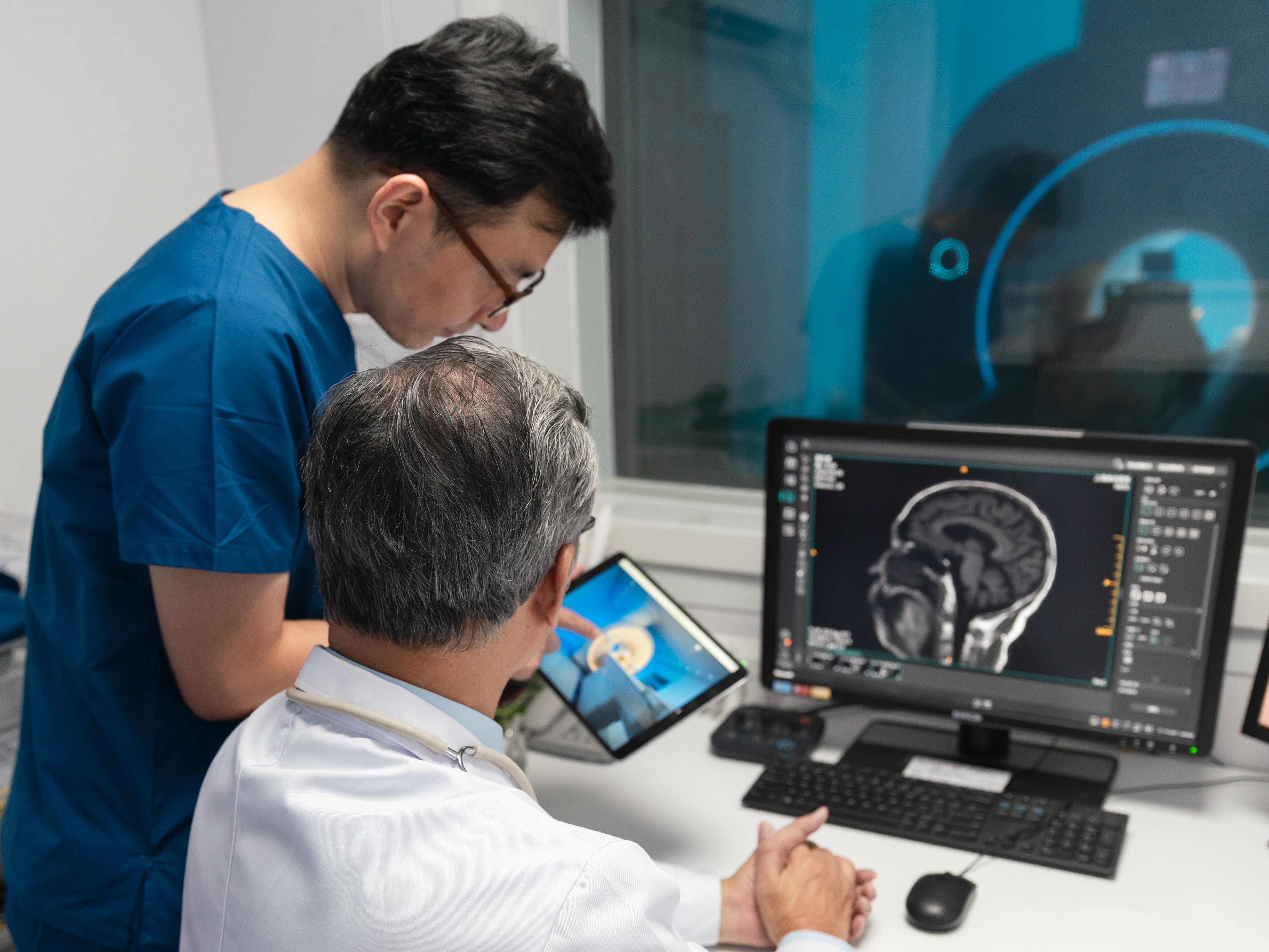Healthcare workers looking at a tablet
