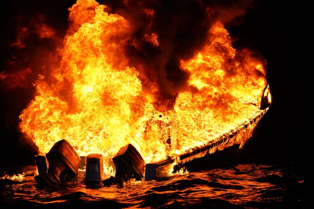 U.S. Coast Guard watching over a burning suspected drug vessel in the Eastern Pacific Ocean after seizing $509.9 million in cartel drugs