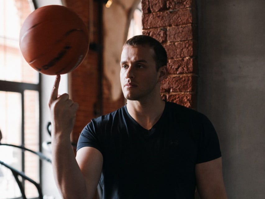 Vadim Fedotov spinning a basketball on his finger