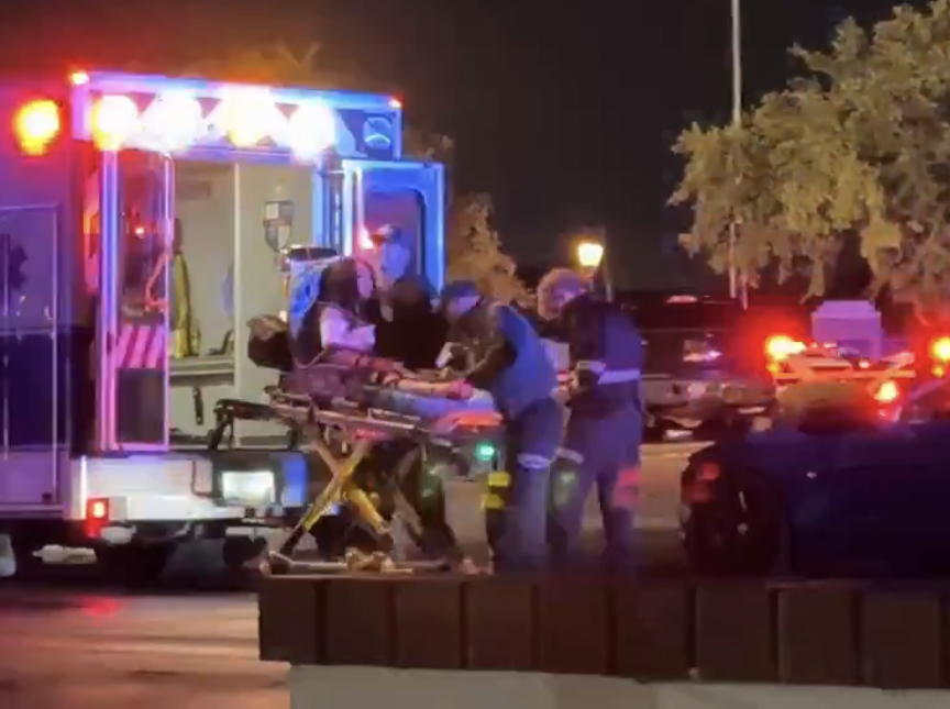 Emergency personnel transporting a victim following a shooting at El Camaron Gigante Mariscos & Steakhouse on Sunday, May 4, 2025.