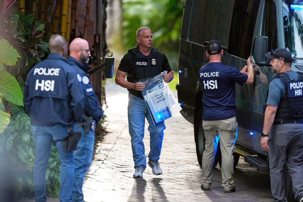 Federal agents outside Diddy's home