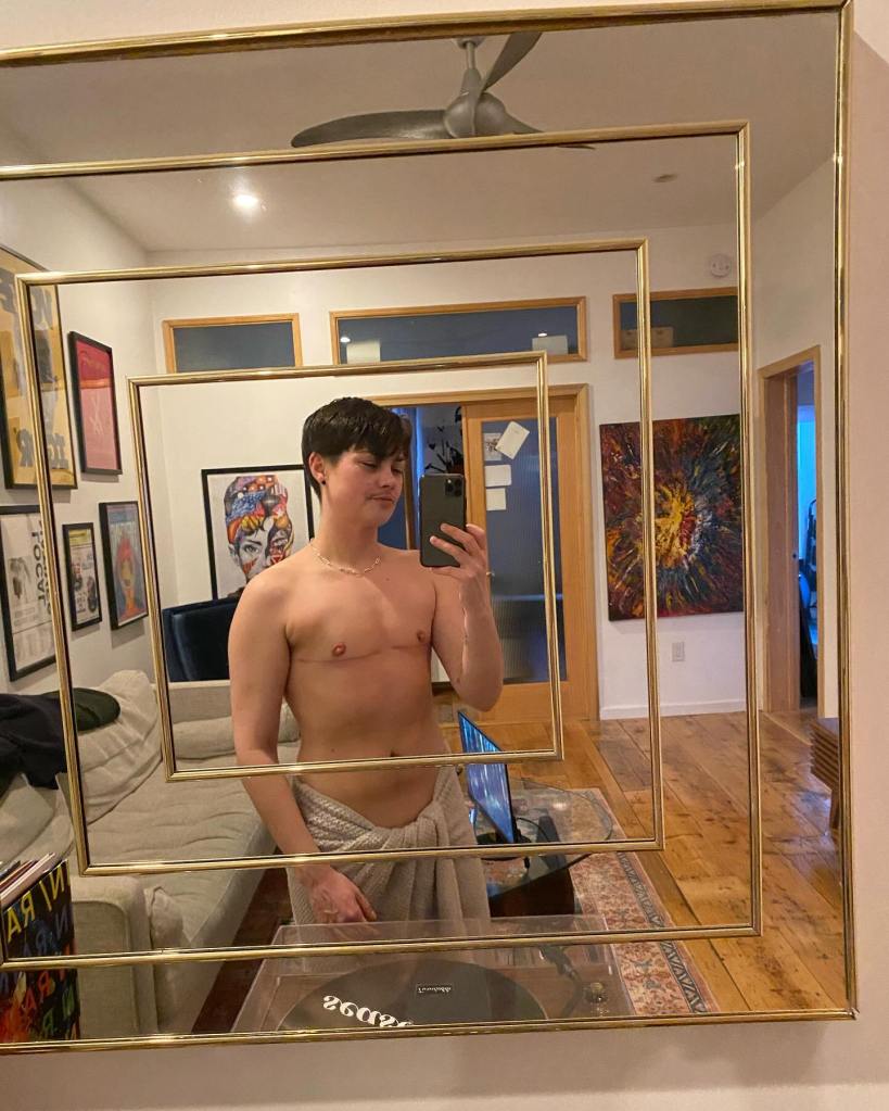 Julz O'Brien in a shirtless mirror selfie. 