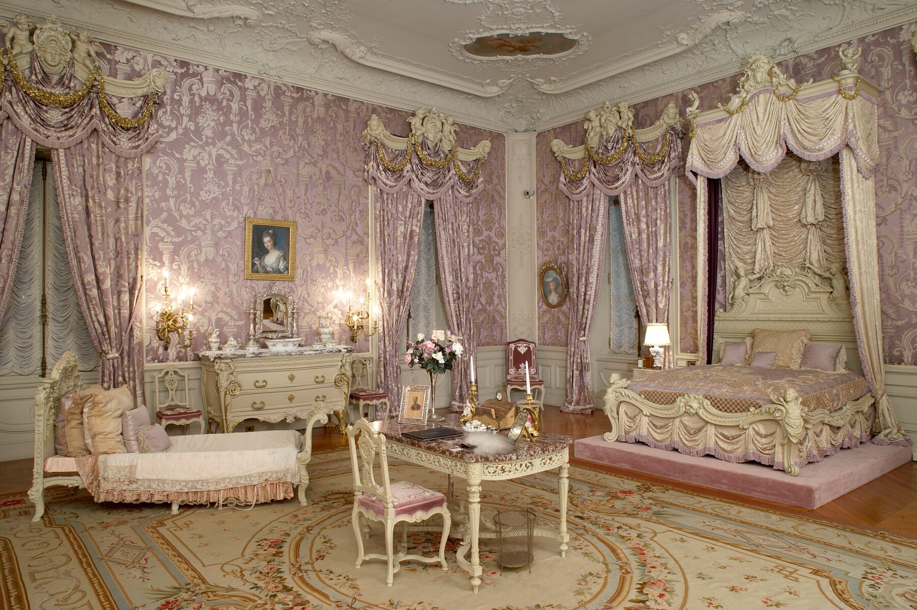 Alva Vanderbilt's bedroom at Marble House with purple silk wallpaper.