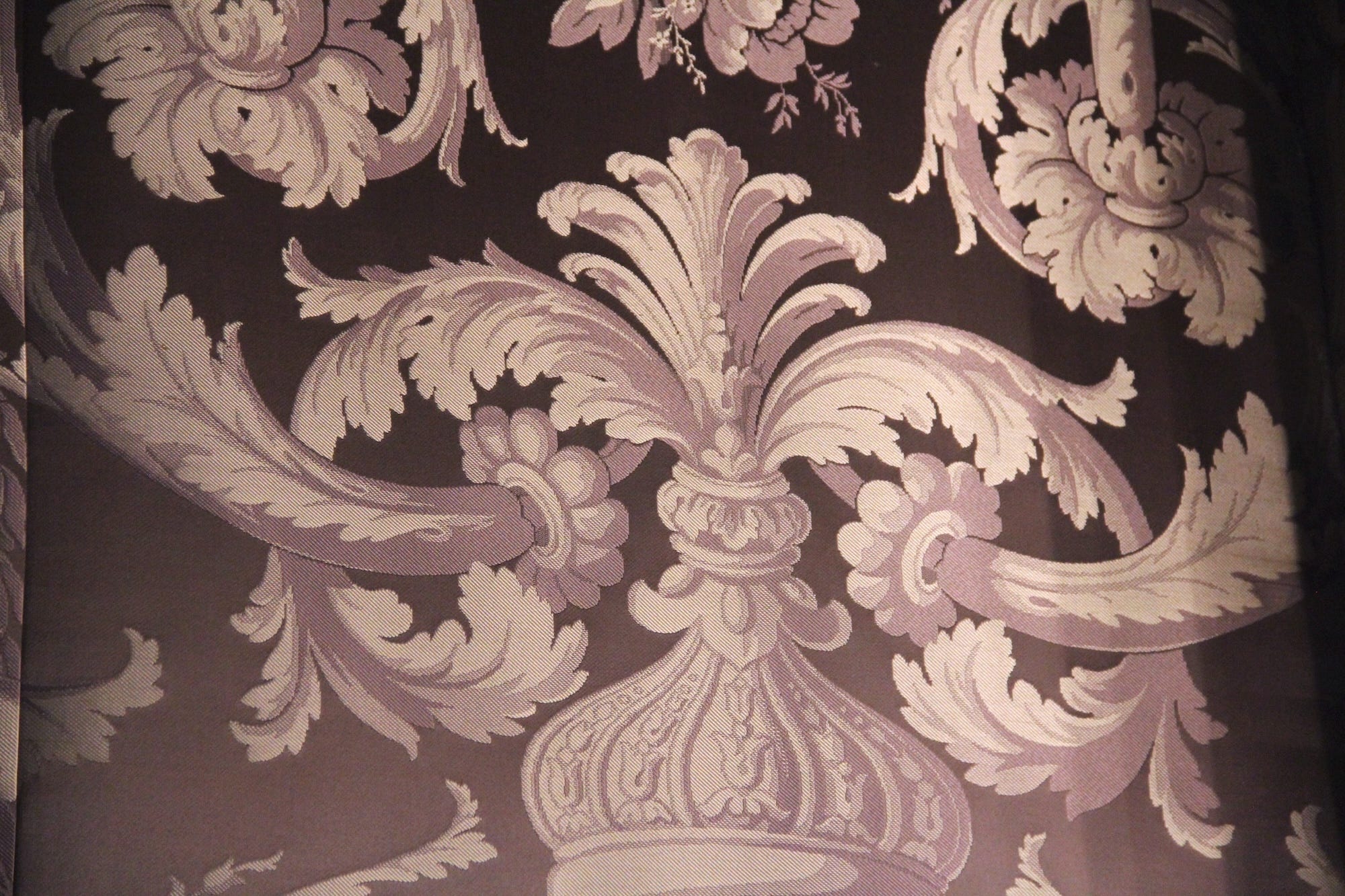 A close-up of Alva Vanderbilt's purple wallpaper at Marble House.