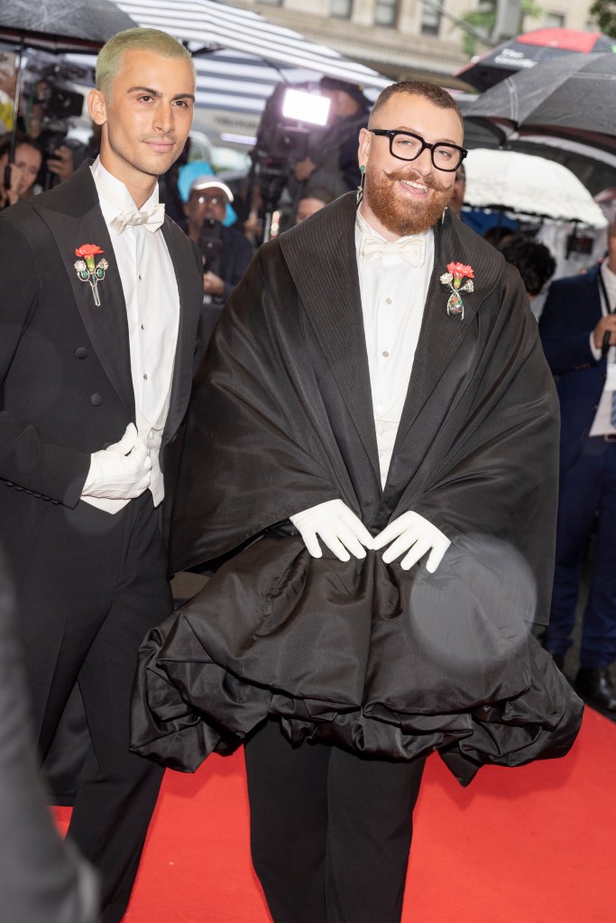Christian Cowan and Sam Smith leave the mark hotel for the Met Gala on Monday evening. 