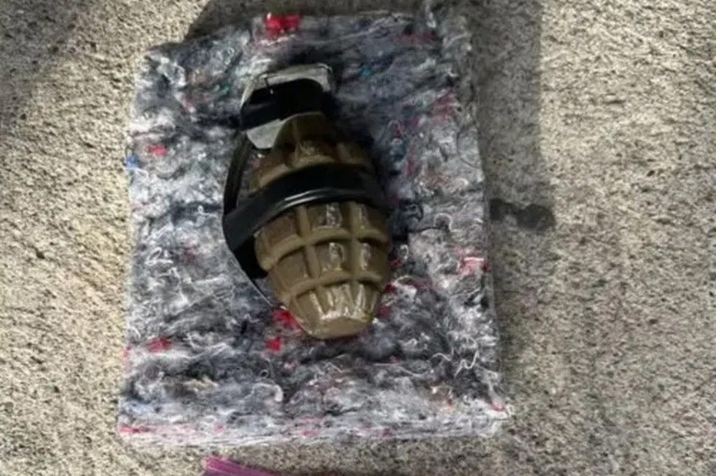 The live grenade that a suspect hurled at police during a chase in Oakland.