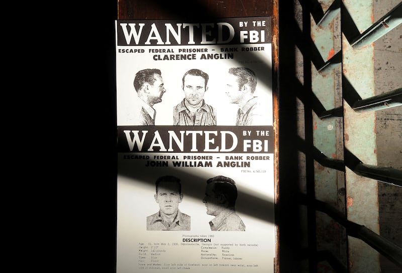 FILE PHOTO: A copy of John and Clarence Anglin's wanted poster rests outside a medical cell on Alcatraz Island on Monday, June 11, 2012, in the San Francisco Bay. The brothers, along with fellow inmate Frank Morris, escaped from the federal prison on June 11, 1962.  REUTERS/Noah Berger/File Photo