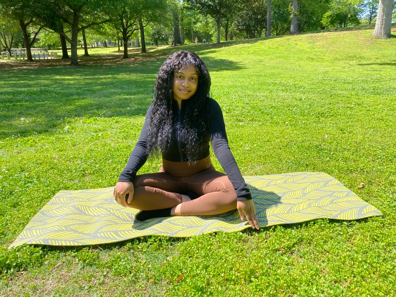 Author
Amaris Ramey smiling on yoga mat