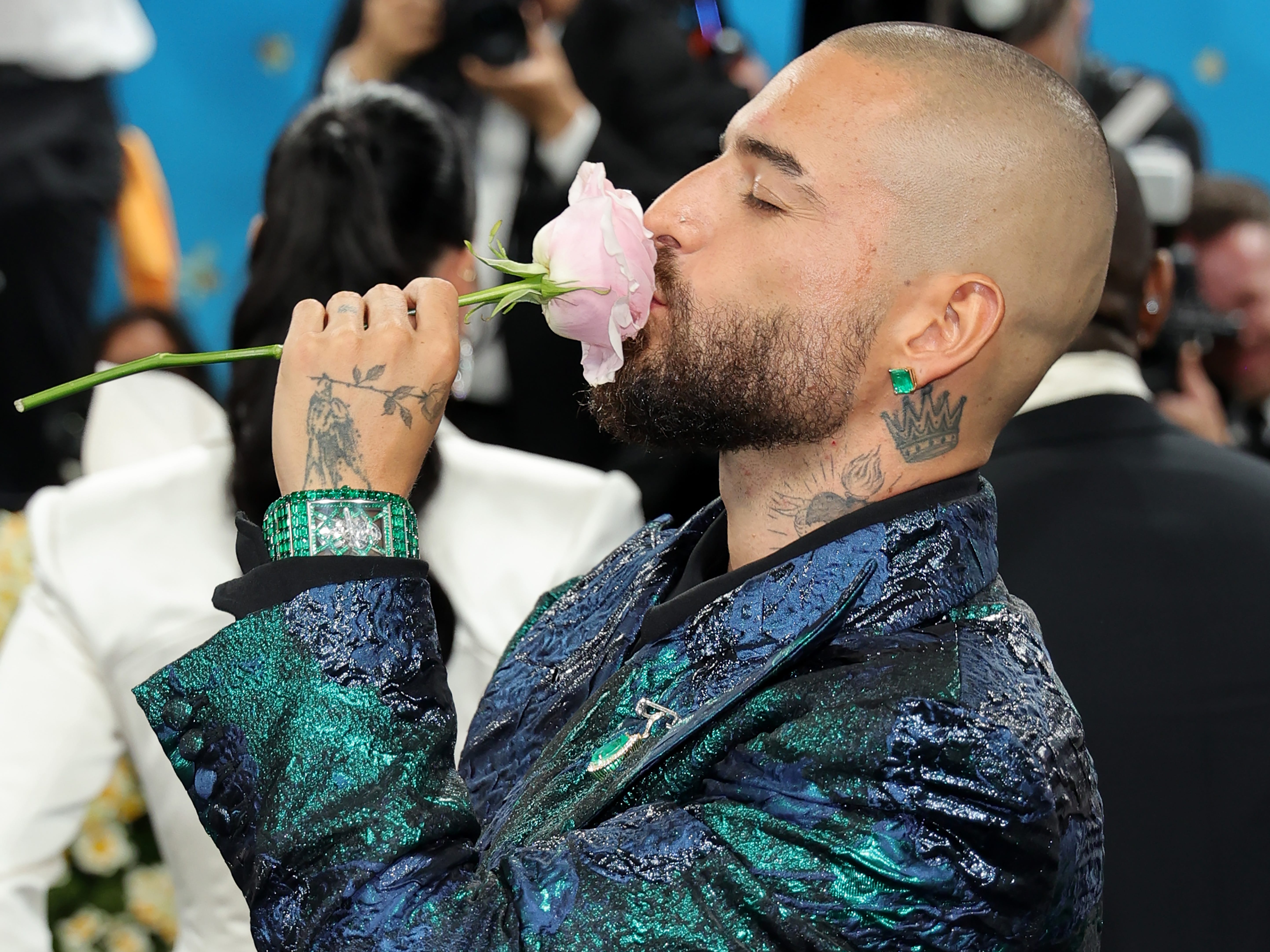 Maluma kisses a pink rose at the Met Gala.