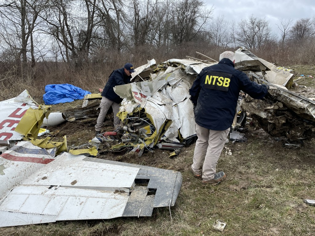 NTSB investigators at the site of the April 12, 2025, crash of a Mitsubishi MU2B airplane in Copake, New York. 