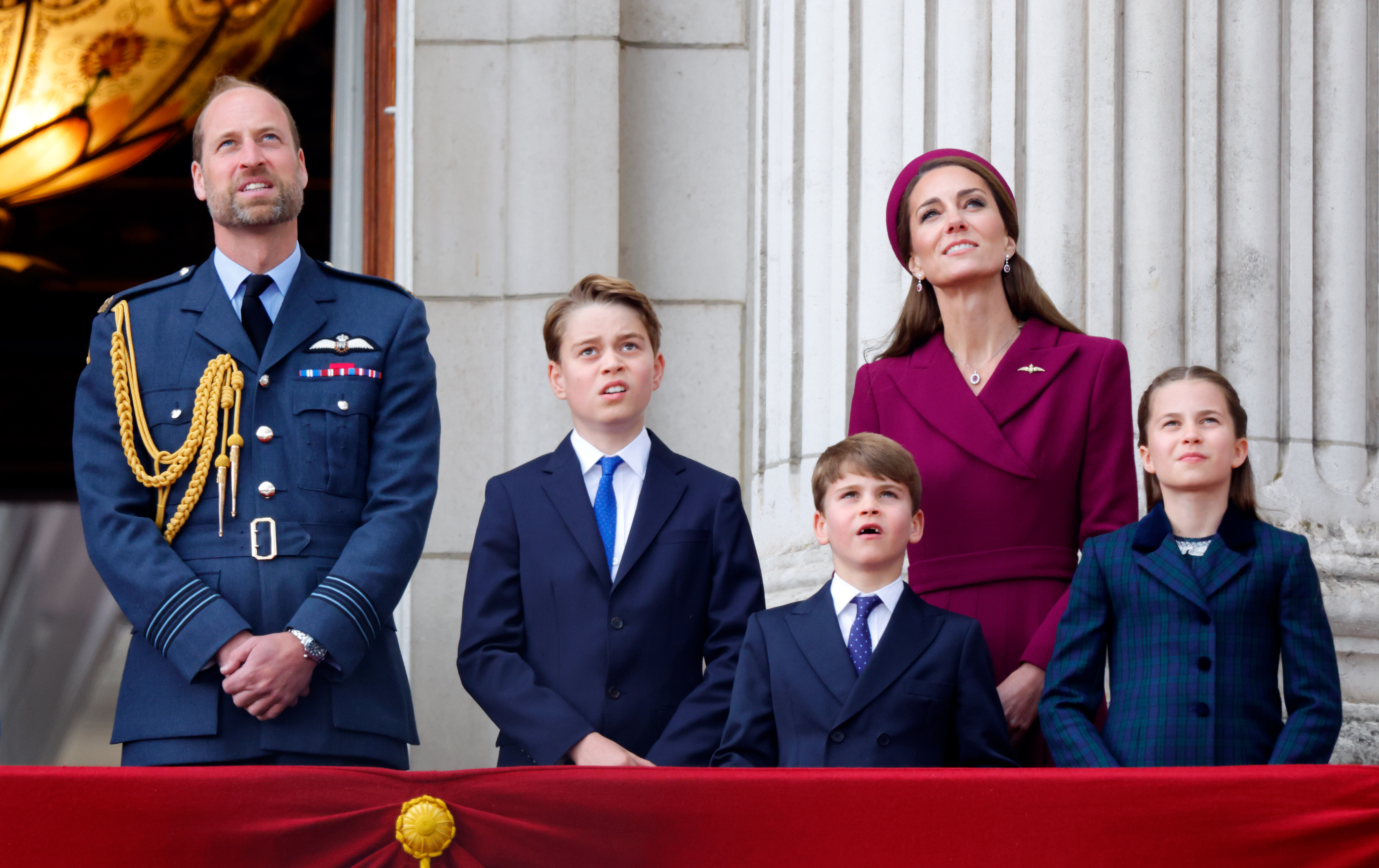 Prince William, Kate Middleton, Princess Charlotte, Prince George and Prince Louis watching a flypast from the balcony of Buckingham in 2025.