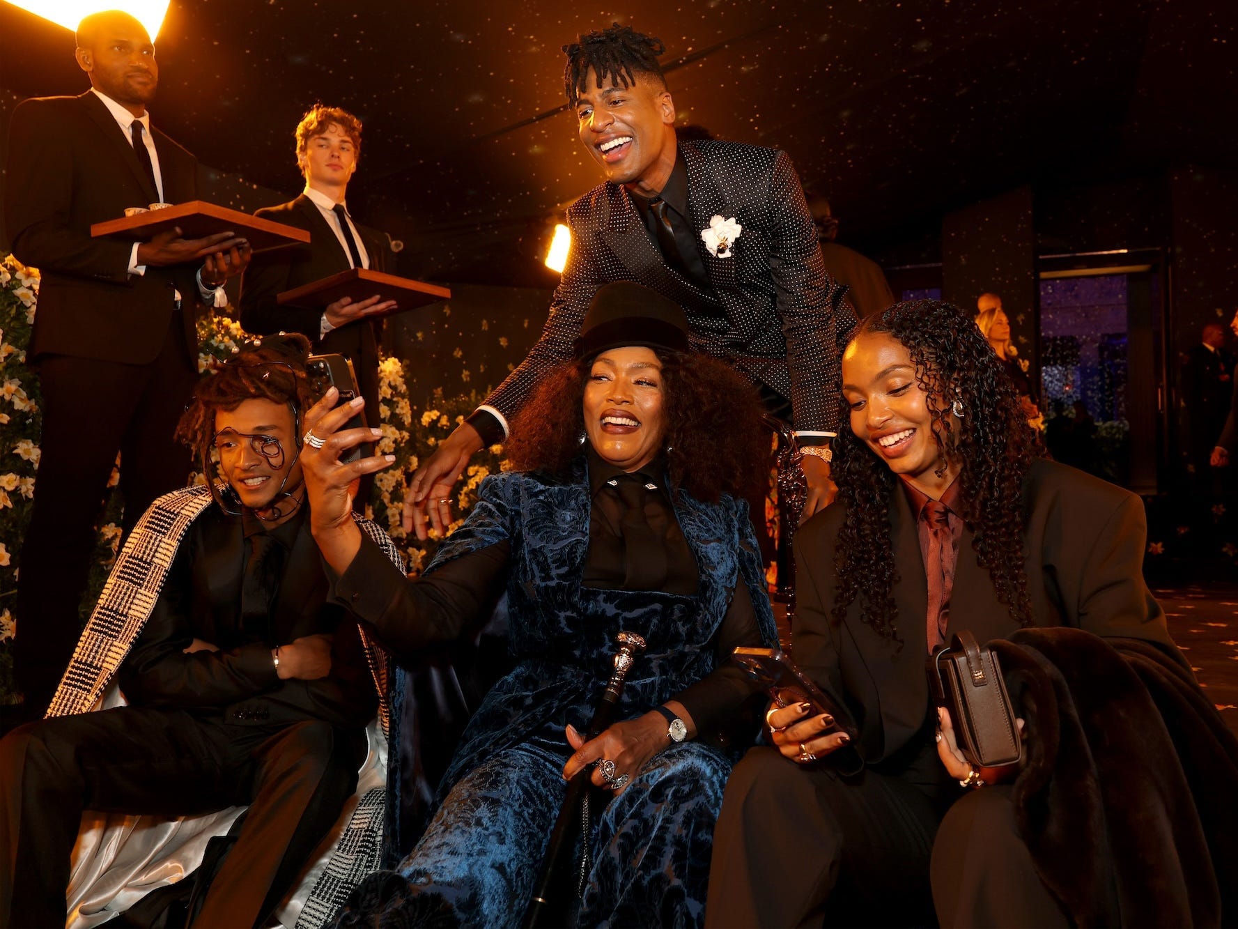 Angela Bassett and Jon Batiste pose for a selfie.