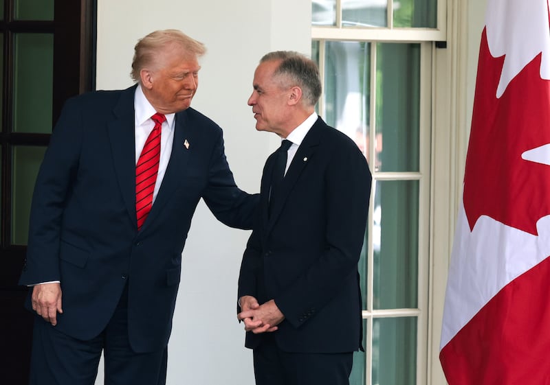 President Donald Trump greets Canadian Prime Minister Mark Carney as he arrives at the West Wing of the White House on May 6, 2025 in Washington, DC. Carney, who was elected into office last week, is expected to meet with President Trump to discuss trade and the recent tariffs imposed on Canada.