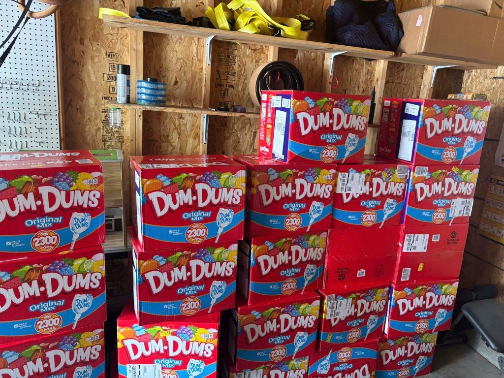 The boxes of lollipops were moved to the family's garage after they were delivered.