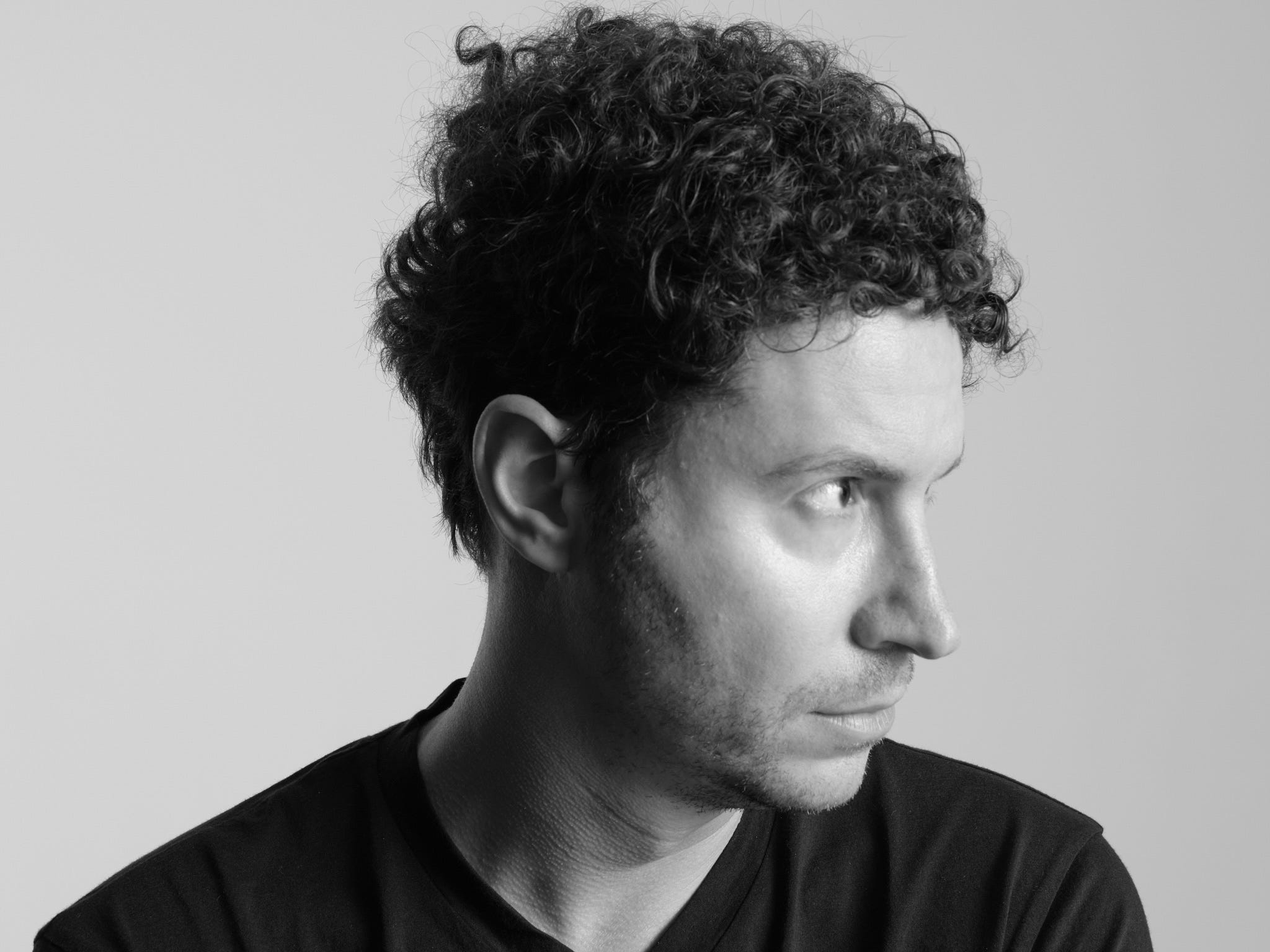 Daniel Nadler, founder of OpenEvidence, in a black and white headshot turned to the side.